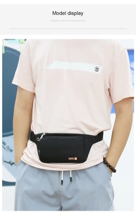 Detail shot of black waterproof nylon sports waist bag with zipper pocket and adjustable strap