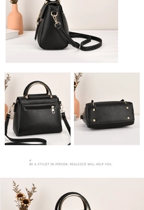 Detail view of black pebble leather tote featuring gold hardware and protective base studs