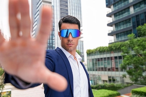 Blue mirrored cycling sunglasses for women featured on model in urban sport setting