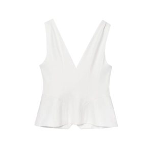Detail of white linen-blend V-neck tank top with cinched waist and pleated hem