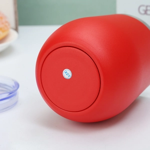 Close-up of matte red egg-shaped stainless steel tumbler base showing finish quality