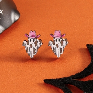 Close-up of Halloween ghost earrings with pink cowboy hats and cow print patterns