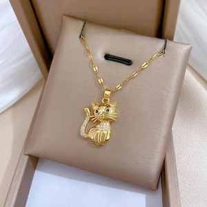 Elegant gold cat pendant necklace with sparkling white zircons and black gemstone eyes