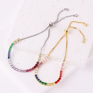 Macro detail of adjustable rainbow tennis bracelets in gold and silver plating