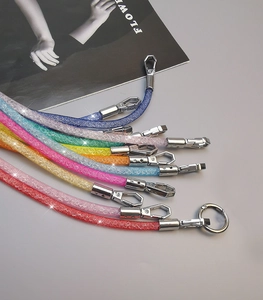 Detailed view of colorful rhinestone mesh mobile phone straps with metal clasps