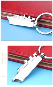 Detail of creative metal cruise ship keychain with built-in functional bottle opener