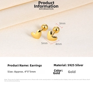 Macro detail of S925 sterling silver gold heart stud earrings with screw back closure
