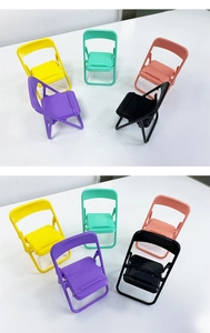 Overhead view of colorful mini folding chair phone holders in five vibrant macaron shades