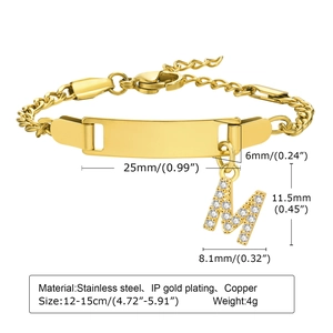 Detail of gold Cuban chain bracelet with customizable nameplate and letter M charm