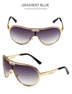 Macro view of gradient blue lenses and gold metal hollow temples on oversized sunglasses