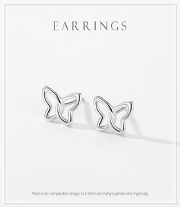 Detailed view of hollow butterfly silver earrings with minimalist metal design