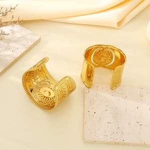 Retro gold cuff bangle with engraved sun totem and geometric tribal texture pattern