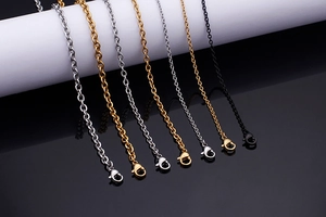 Detail of tassel titanium steel necklaces in gold, silver, rose gold, and black with lobster clasps