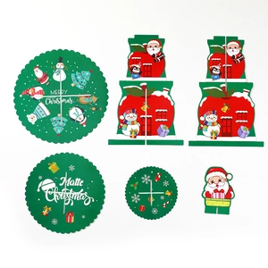 Flat lay showing Christmas paper cake stand components with Santa and gift designs