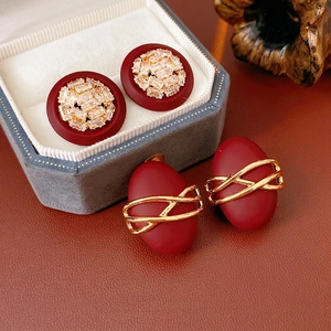 Vintage gold-plated earrings with reddish-brown matte finish and zircon stone accents