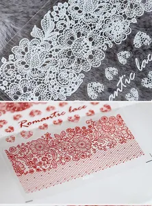 Detailed close-up of KX series romantic lace nail art stickers in red and white floral patterns