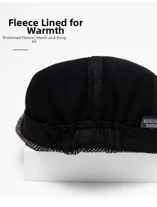 Detail of wool blend newsboy cap showing warm fleece lining and elastic back design
