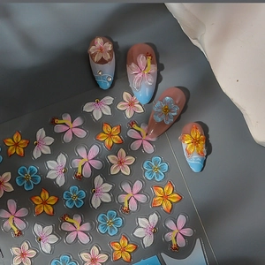 3D floral nail art stickers with embossed flower designs and glitter for DIY manicures
