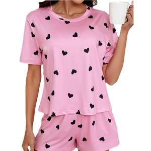 Pink short sleeve pajamas set with black heart print and elastic shorts for women