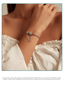 Detailed view of S925 silver snake chain bracelet with cubic zirconia cylinder clasp