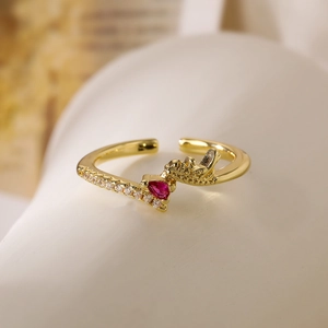 Gold plated geometric open ring featuring a red heart stone and zircon accents