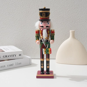 Classic wooden Christmas Nutcracker drummer ornament with red, green and gold uniform