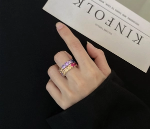 Close-up of double layer silver ring with multi-color gemstones on Kinfolk magazine background