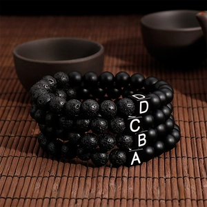 Set of 4 black lava stone bead bracelets with A-B-C-D initial stainless steel charms