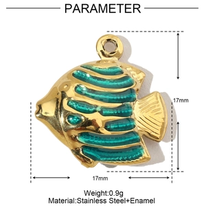 Macro view of tropical fish pendant in gold stainless steel with green enamel stripes