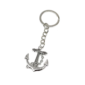 Detail of a silver nautical anchor keychain featuring intricate chain wrap and a polished finish