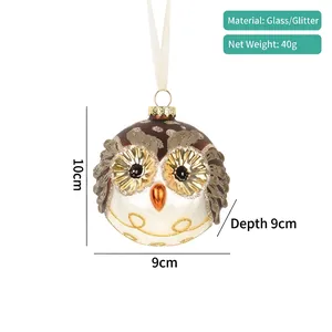 Detailed view of glass owl Christmas ornament with glitter accents and size dimensions