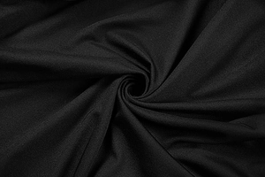 Macro shot of high-quality black mesh fabric with fine weave texture and soft drape