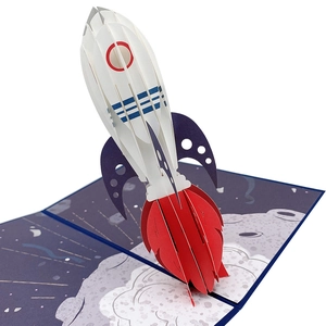 Detailed close-up showing the 3D pop-up rocket launch mechanism of the paper greeting card