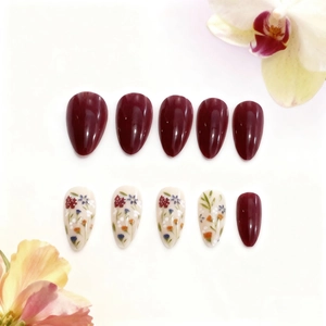 Long almond press-on nails set with wine red glossy finish and floral art patterns