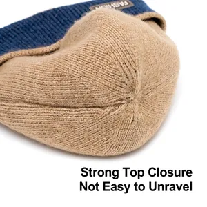 Winter knitted beanie in navy and camel color block design with thick fleece lining