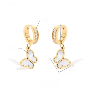 Detail of gold hoop earrings with butterfly shell pendants and cubic zirconia accents