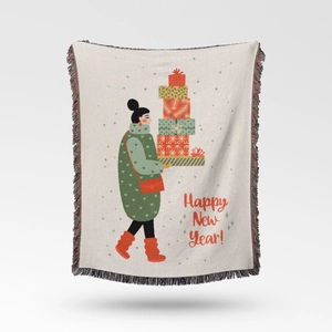 Detail of knit Christmas throw blanket with festive gift illustration and colored tassels