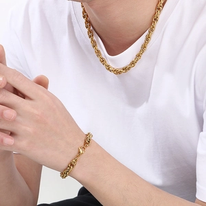 Detail of twisted rope chain necklace and bracelet set in 18k gold plated stainless steel
