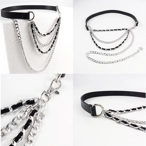 Detail of punk multi-layer chain belt with silver star pendant and leather strap