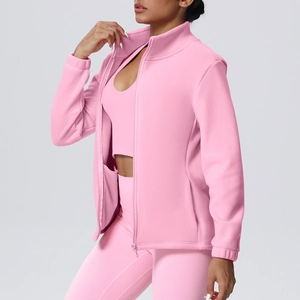 Three-piece pink sports set with high collar zip jacket and matching yoga leggings