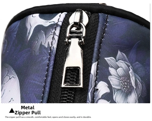 Detailed close-up of a premium silver metal zipper pull on a floral fabric tote bag