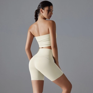 Two-piece cream yoga set featuring a non-slip tube top and high-waist fitness shorts