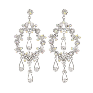 Elegant silver chandelier earrings with intricate metal cutouts and teardrop rhinestones