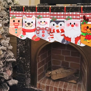 Set of six Christmas stockings with cartoon characters hanging on a brick fireplace mantel
