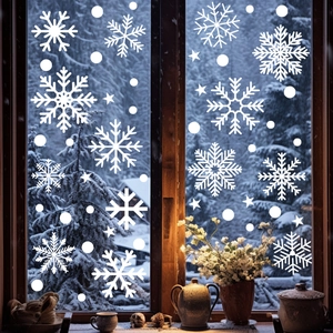 Winter scene featuring white snowflake window stickers and holiday decor on a windowsill