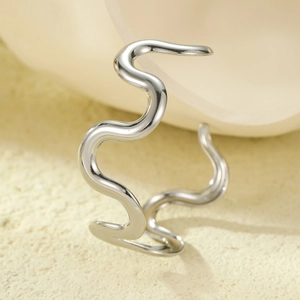 Minimalist silver wavy irregular ring with a polished finish and streamlined design