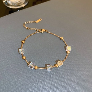 Detail of 18K gold-plated box chain bracelet with iridescent square sugar crystal beads