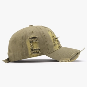 Distressed army green cotton baseball cap with vintage wash and torn hole details