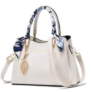 Chic beige lychee leather tote bag with silk scarf and metal leaf charm detail