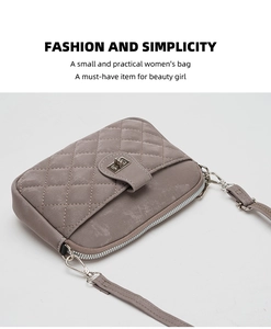 Detail view of taupe quilted crossbody bag showing metal turn-lock and leather texture